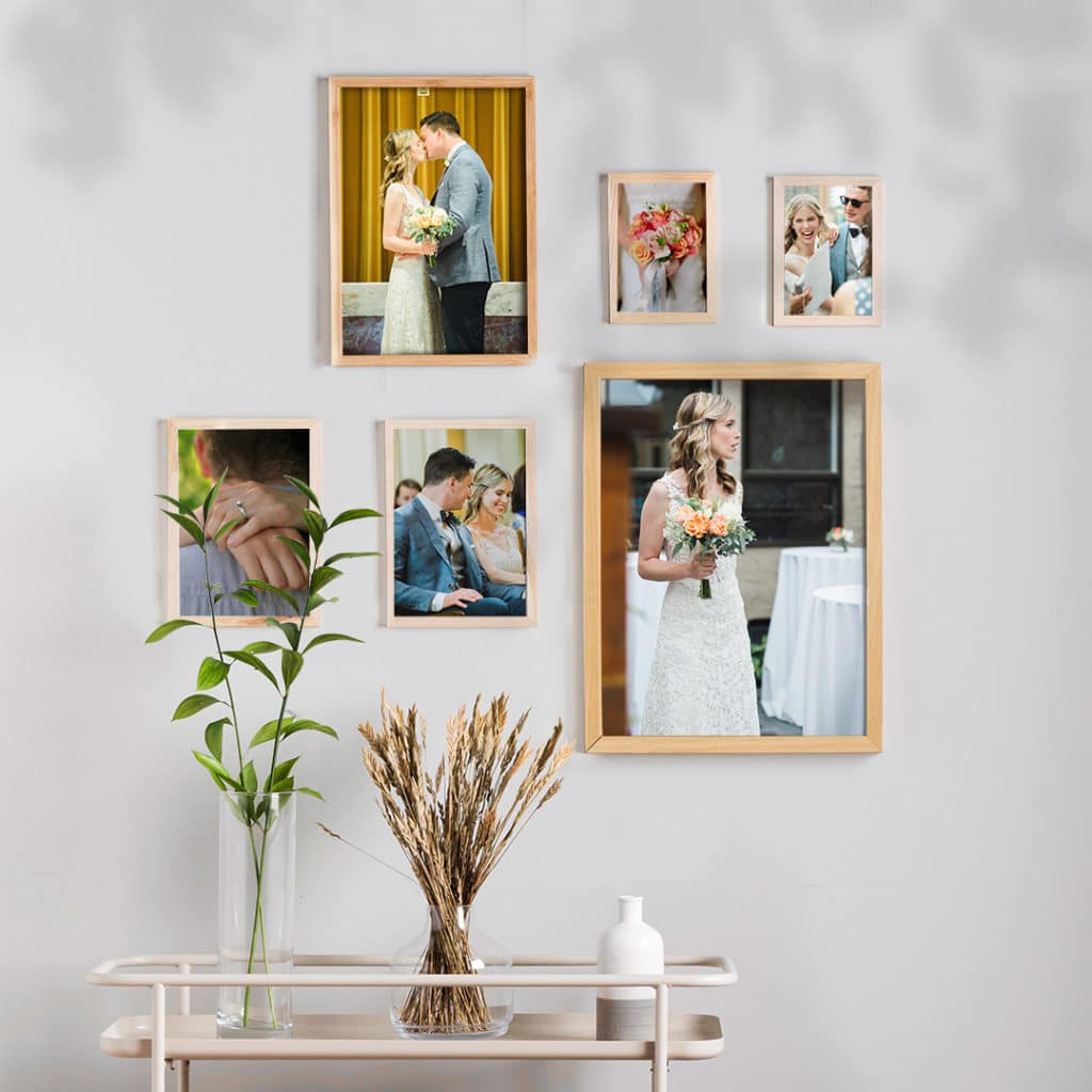 framed wedding photos on wall with minimalist interior design