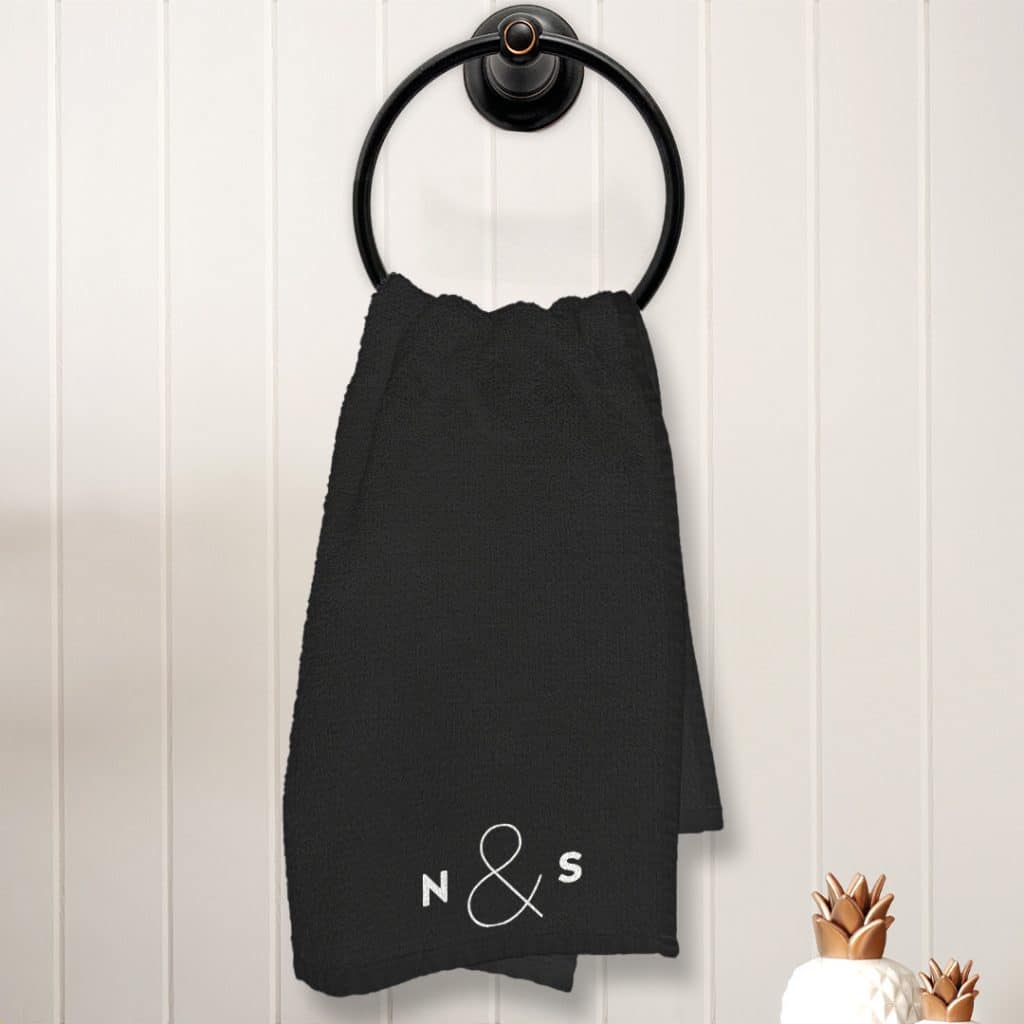 Big Ampersand tea towel design featuring a simple white monogram on a black towel