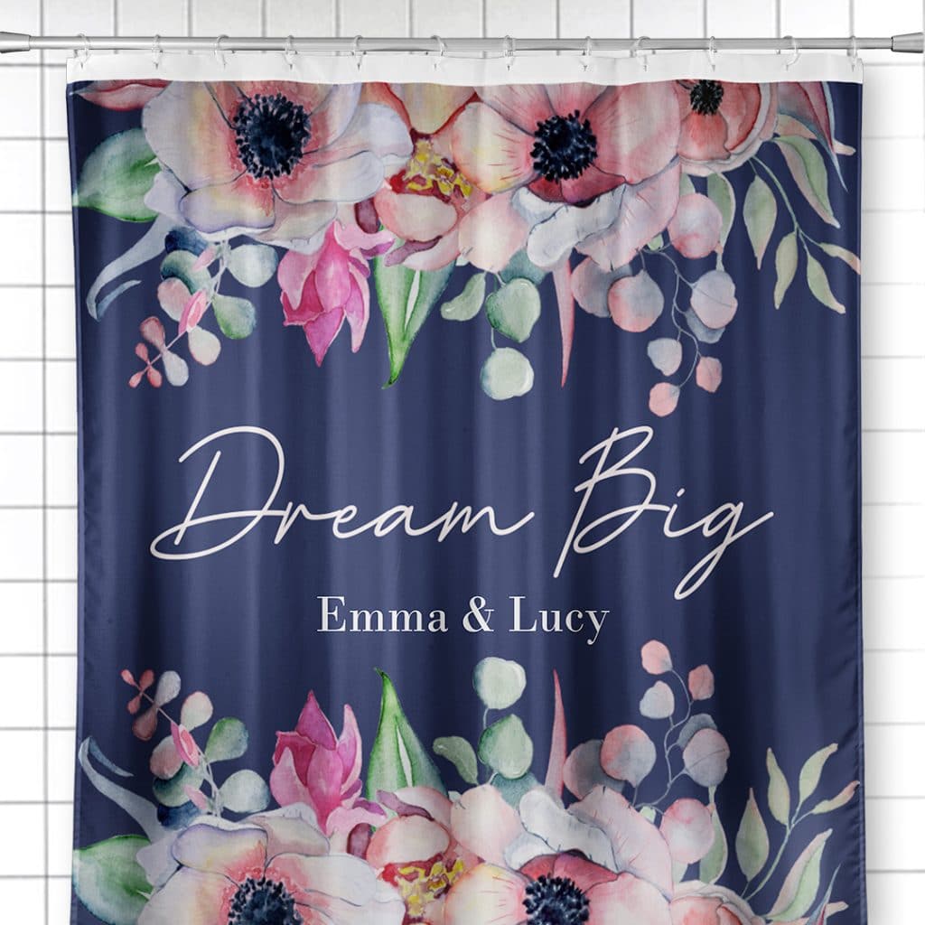 Photo of shower curtain featuring Dream Big floral design and the names "Emma & Lucy"