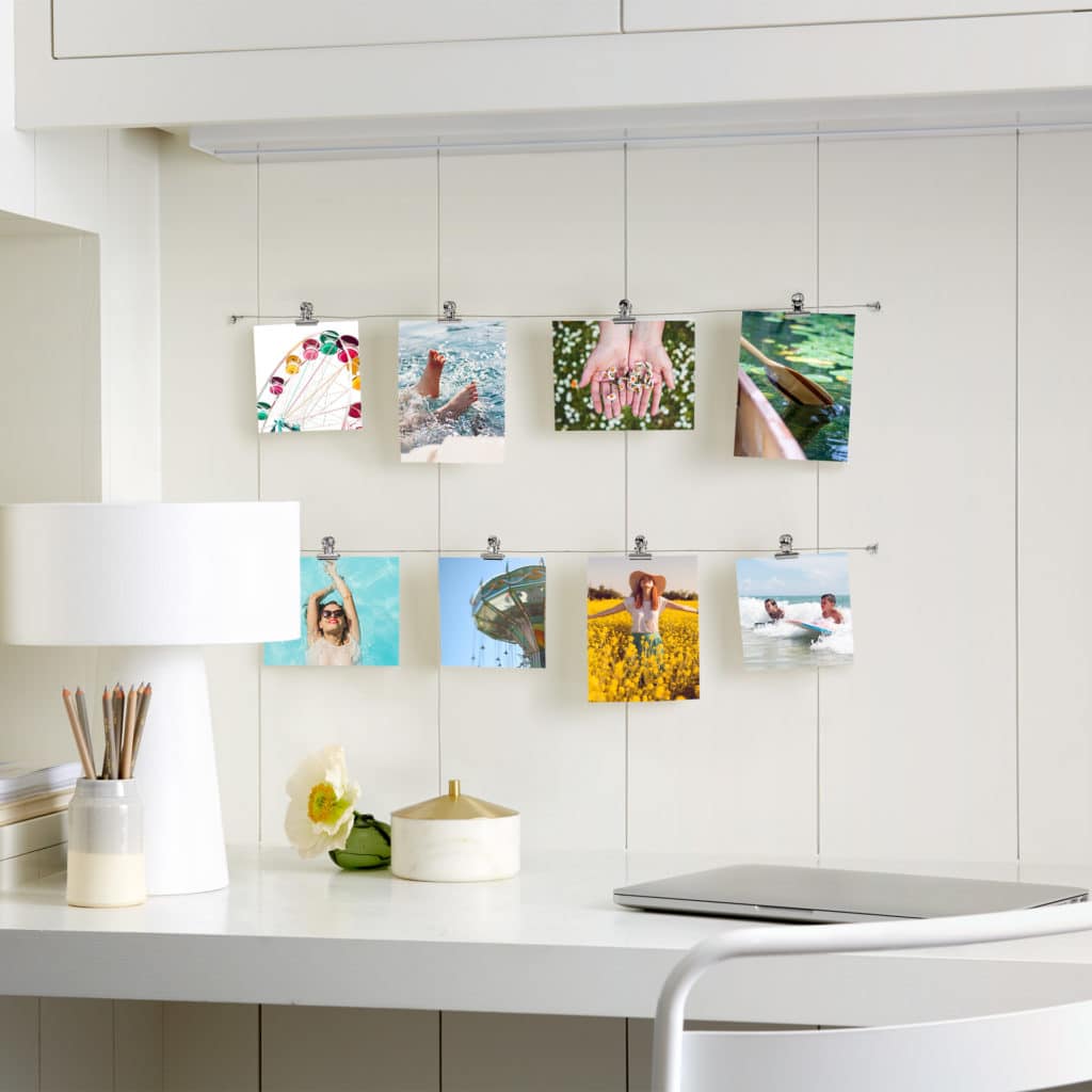 String photo prints together to an attractive photo wall display